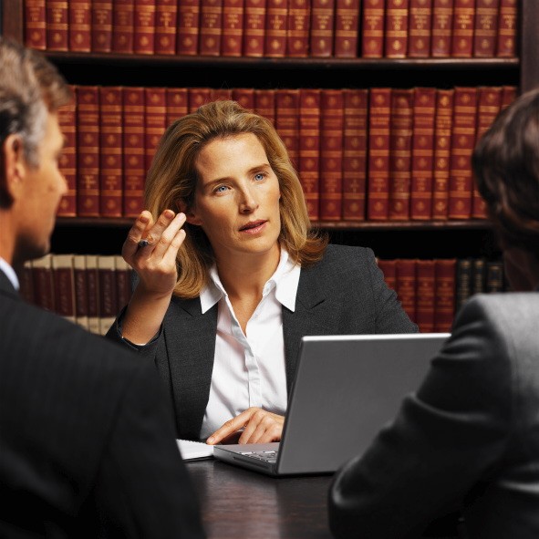 female attorney in front of law books