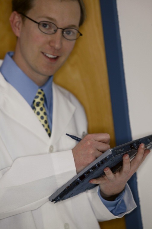 doctor holding a tablet using technology as the legal nurse consultant's friend