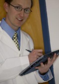 doctor holding tablet