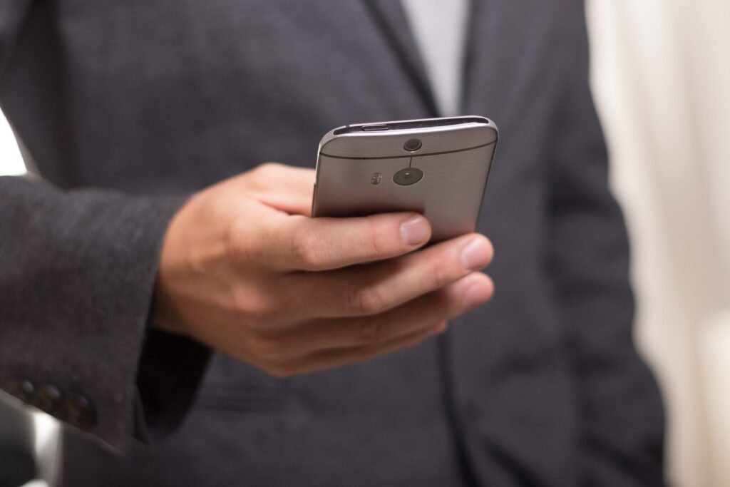 business man holding phone