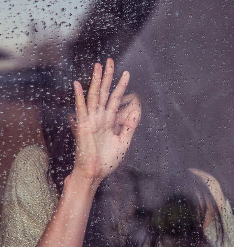 woman covering her face