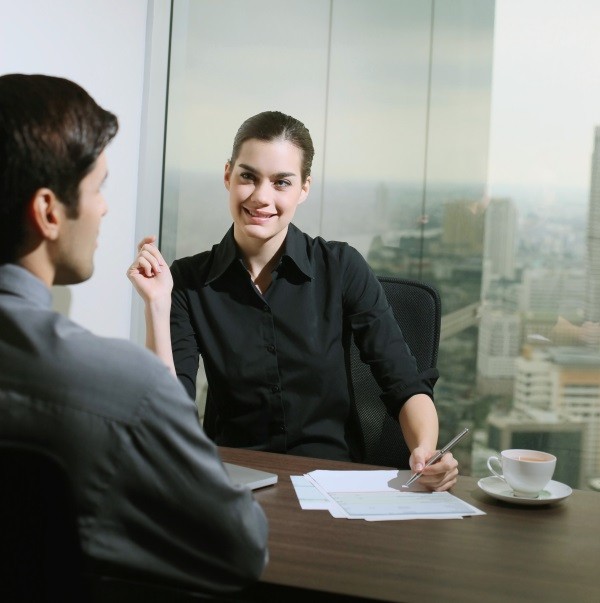 man and woman in office