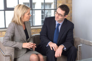 man and woman on couch in a strong relationship