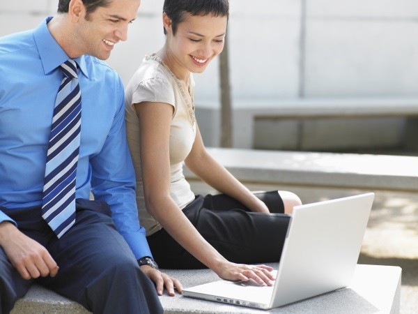 man and woman at computer